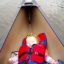 Sulia sleeping in canoe
